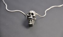 skull x skull pendant